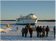 An energized crowd waits for the Ferry to reach the dock